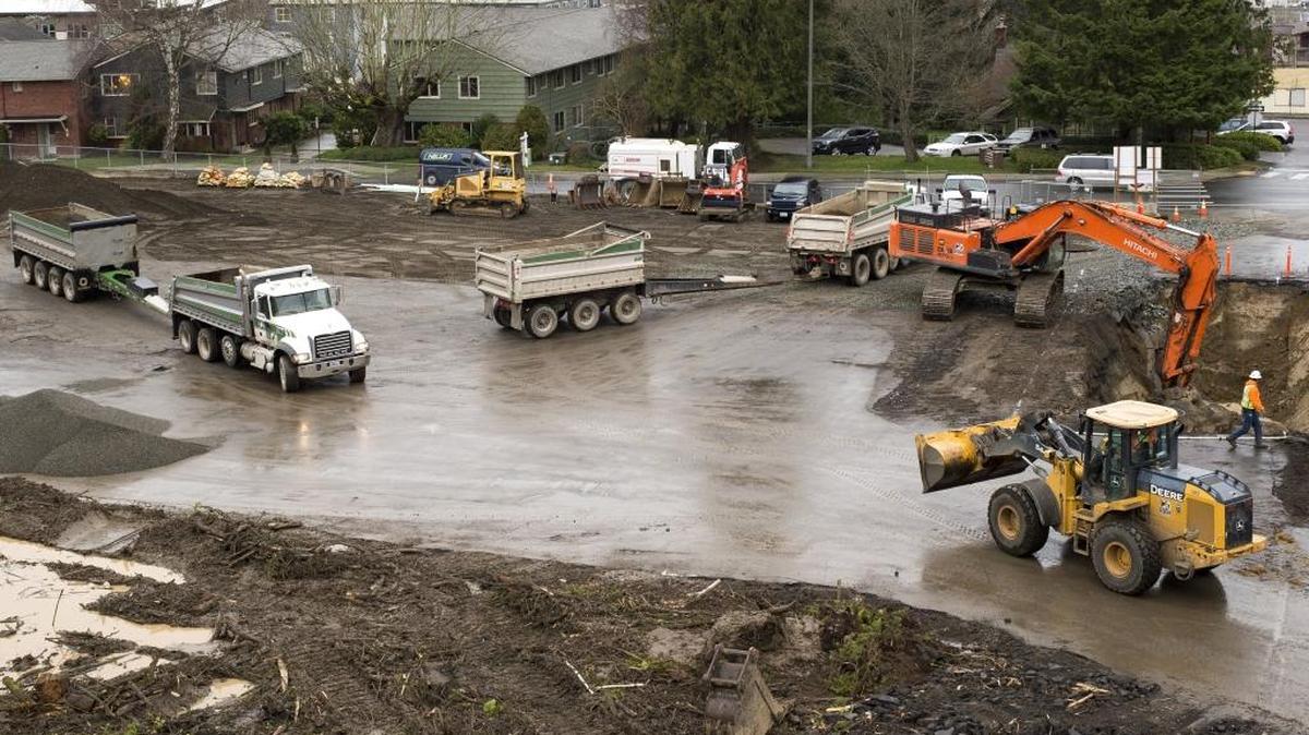 Construction crews work Feb. 3 at the former site of the Seventh-day Adventist Church on North Forest Street, where a 423-bed facility geared toward college students will be built.
