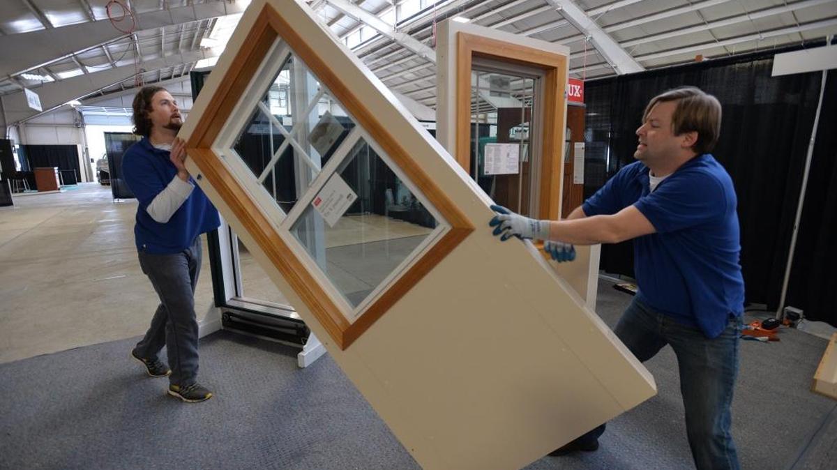 Lyndale Glass employees Dib Kirk, left, and Dave Reimink set up a window display at the Northwest Washington Fairgrounds & Event Center in Lynden on Feb. 27, 2014, in preparation for the annual Building Industry Association of Whatcom County Home and Garden Show. The 2016 show at the fairgrounds runs Friday, March 4, to Sunday March 6.