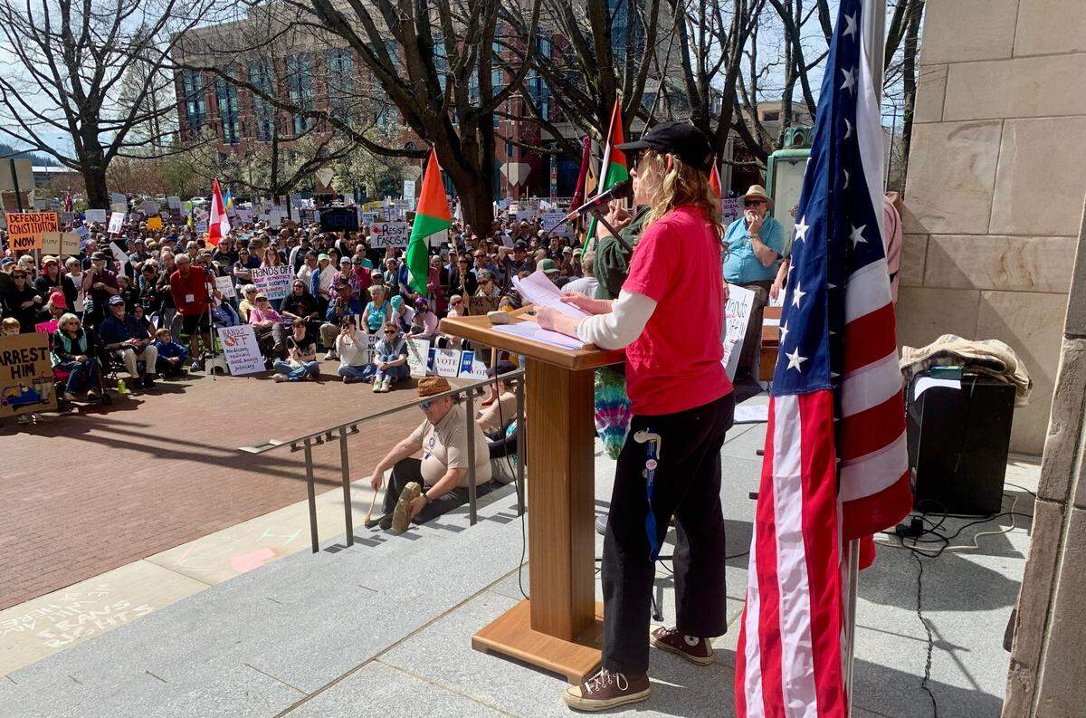 Jade Phillips, community organizer and data manager at Mt. Baker Planned Parenthood, addresses the crowd at City Hall during Bellingham’s Hands Off! protest Saturday.