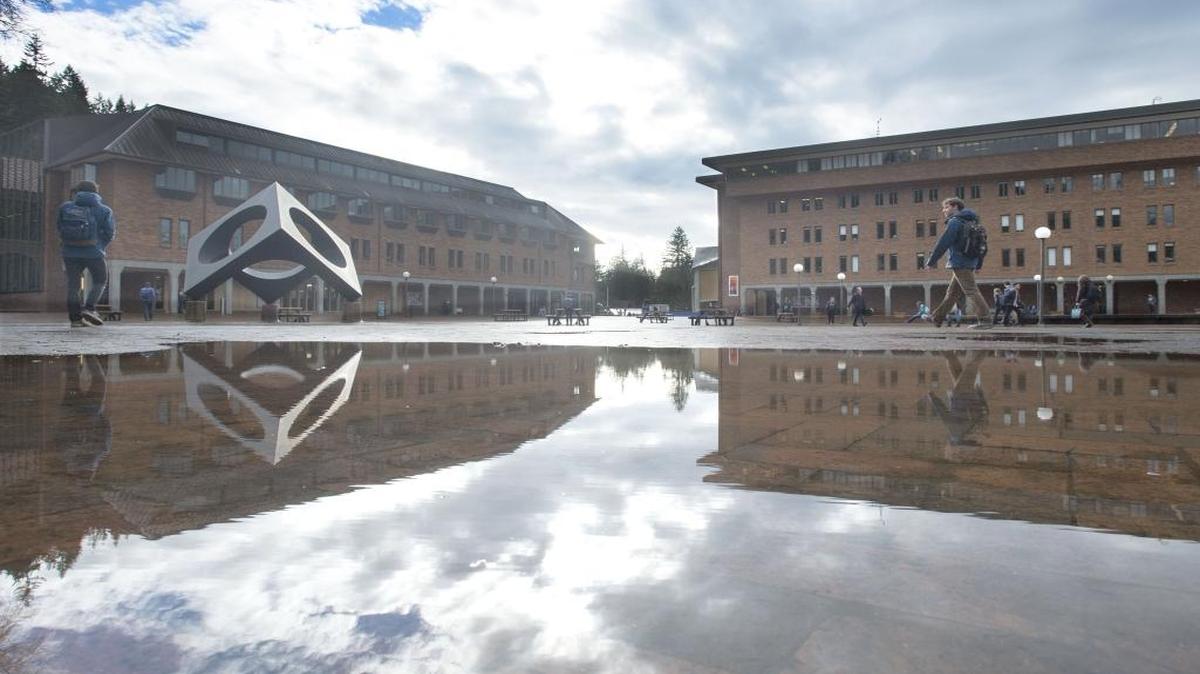 Students and staff avoid large puddles of water on Red Square during a break in the rainy weather at Western Washington University Tuesday, Jan. 26, 2016. Storms this week brought warm temperatures with the rain.