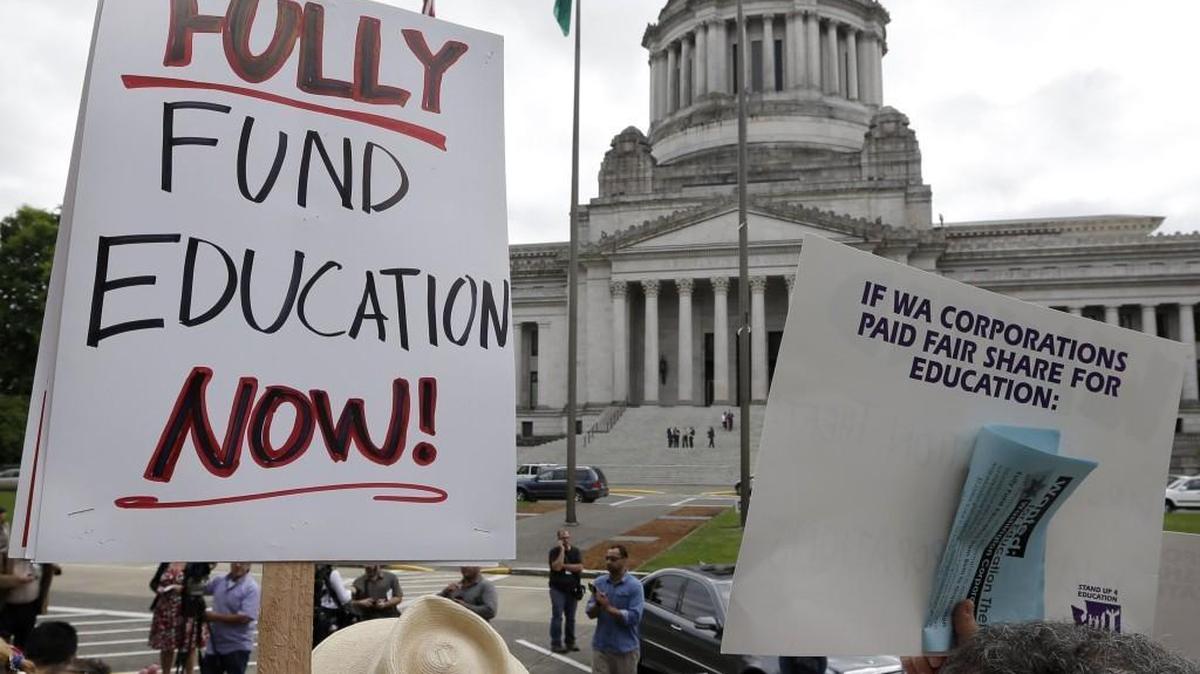 Education supporters demonstrated at the state Capitol in 2014, as the state Supreme Court was hearing the case that led to an order for the Legislature to fully fund schools. More recently, the court has held state in contempt over the Legislature’s failure to come up with a plan to do that by 2018.