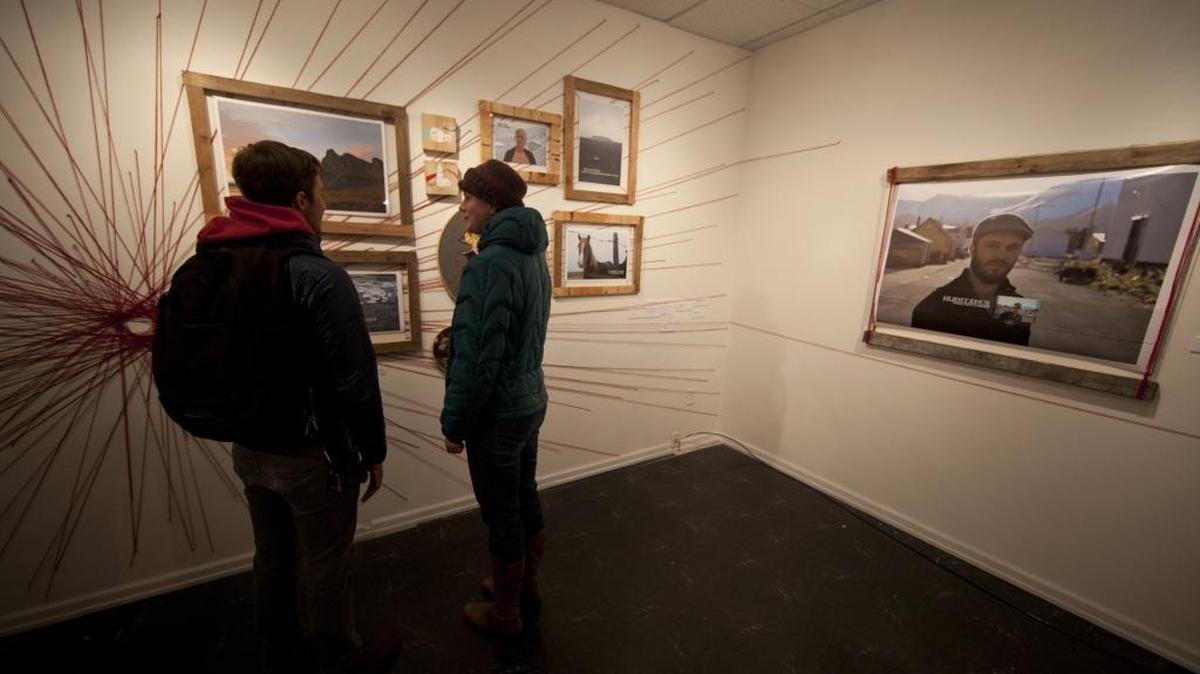 People view the work of William Canepa and Jennifer Dranttel displayed at Make.Shift for Bellingham’s Art Walk in February 2013. The first Art Walk of 2016 has been moved to Jan. 8 to avoid conflicting with New Year’s Day events.