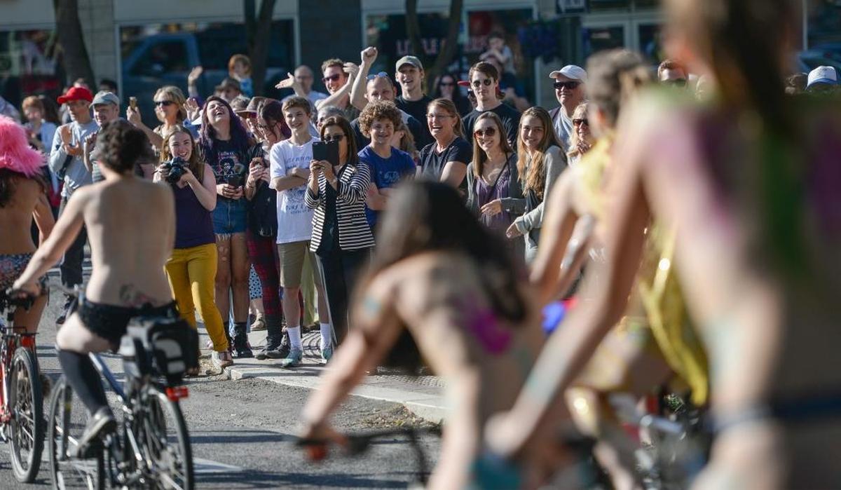 Scantily clad and nude cyclists parade through the streets of Bellingham, Friday, June 2, 2017, for the ninth annual Bellingham World Naked Bike Ride.