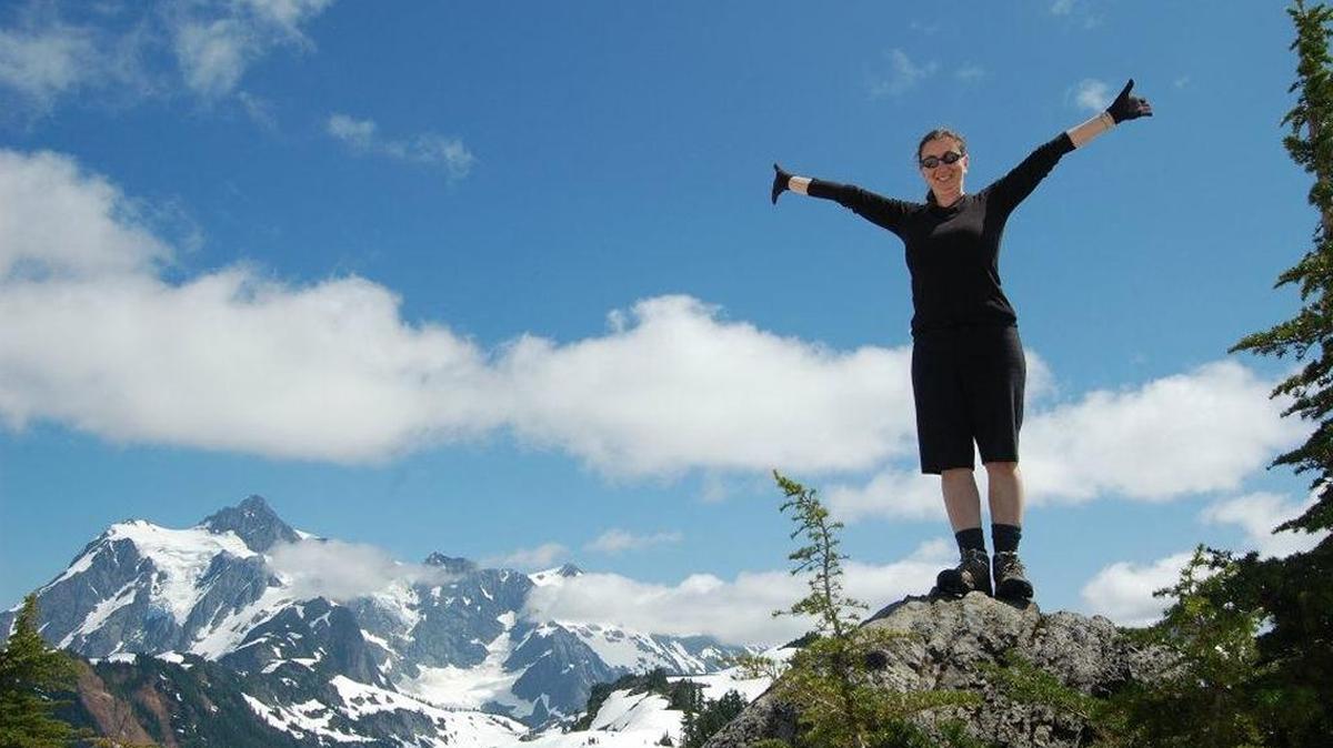 Rebecca Sauter of Bellingham takes in the sweeping vista from a ridge above Artist Point in summer 2011.