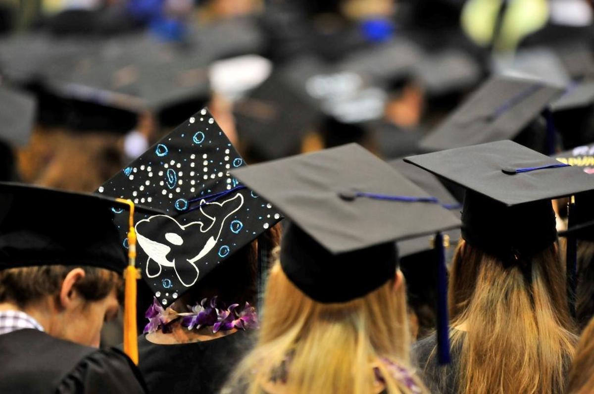 Commencement services for graduating Western Washington University students in Carver Gymnasium at Western in 2014. According to a new report, one factor college grads are leaving Bellingham is that they are seeing more opportunities for job advancement in other places like Seattle.