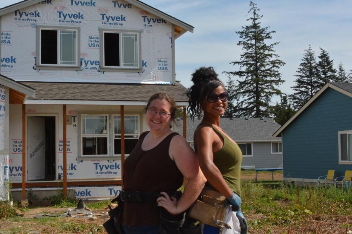 Sarah Richards, left, and Akilah Price are both single mothers who’ve become friends as they worked to build homes in the Drayton Reach development.