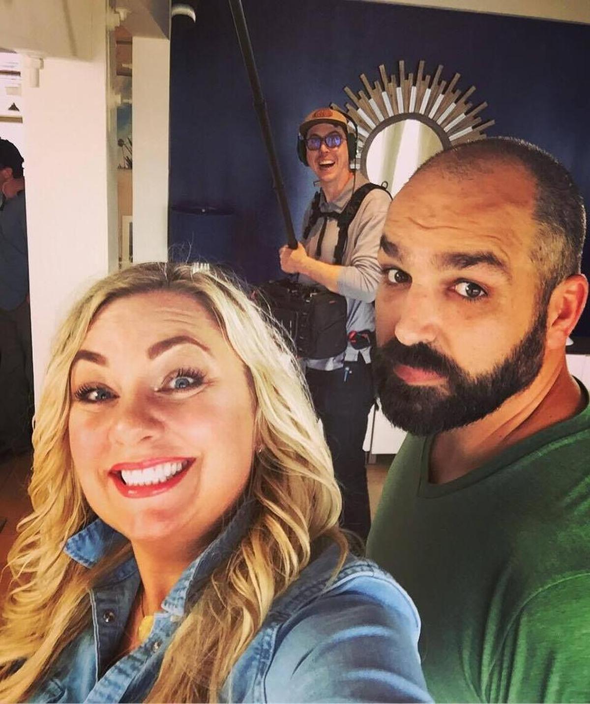 Sara Holliday and her partner Les Meeks take a selfie and gets photo-bombed by a member of the production crew while on break during production of HGTV’s “Beach Hunters.”