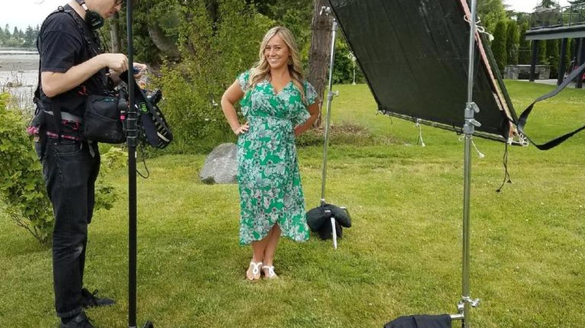 Paulina Antczak, right, waits for the television crew to finish setting up for a video shoot. Antczak will be on an upcoming episode of HGTV’s “Beach Hunters.”