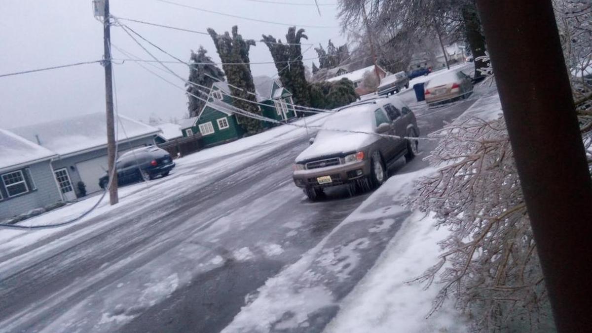 A power pole breaks on a street in Sumas Friday afternoon.