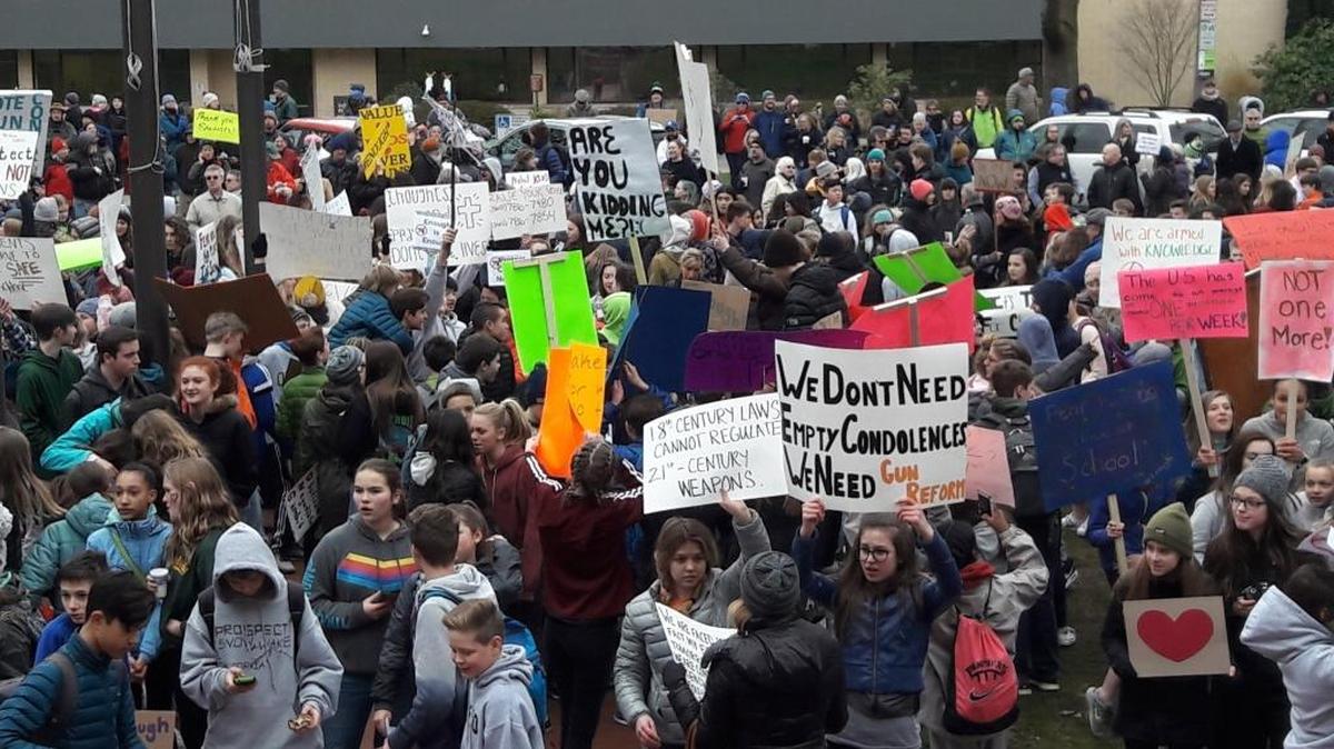 Students from across Bellingham gather in front of City Hall on Feb. 21, 2018, to protest gun violence ands promote school safety. Western Washington University students are organizing a class walkout Wednesday morning, part of a planned nationwide protest of gun violence.
