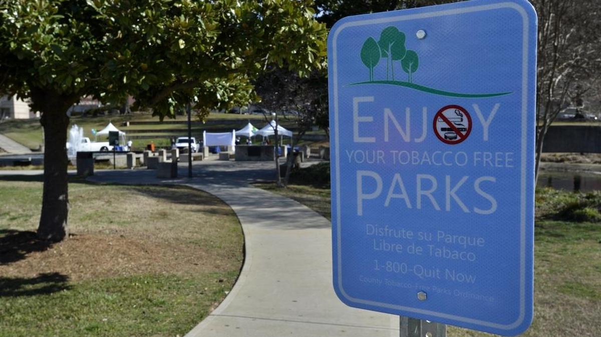 Signs at a Charlotte, N.C., park let visitors know about a smoking ban. Bellingham City Council voted Monday, Nov. 9, to ban smoking in city parks, trails and open spaces.