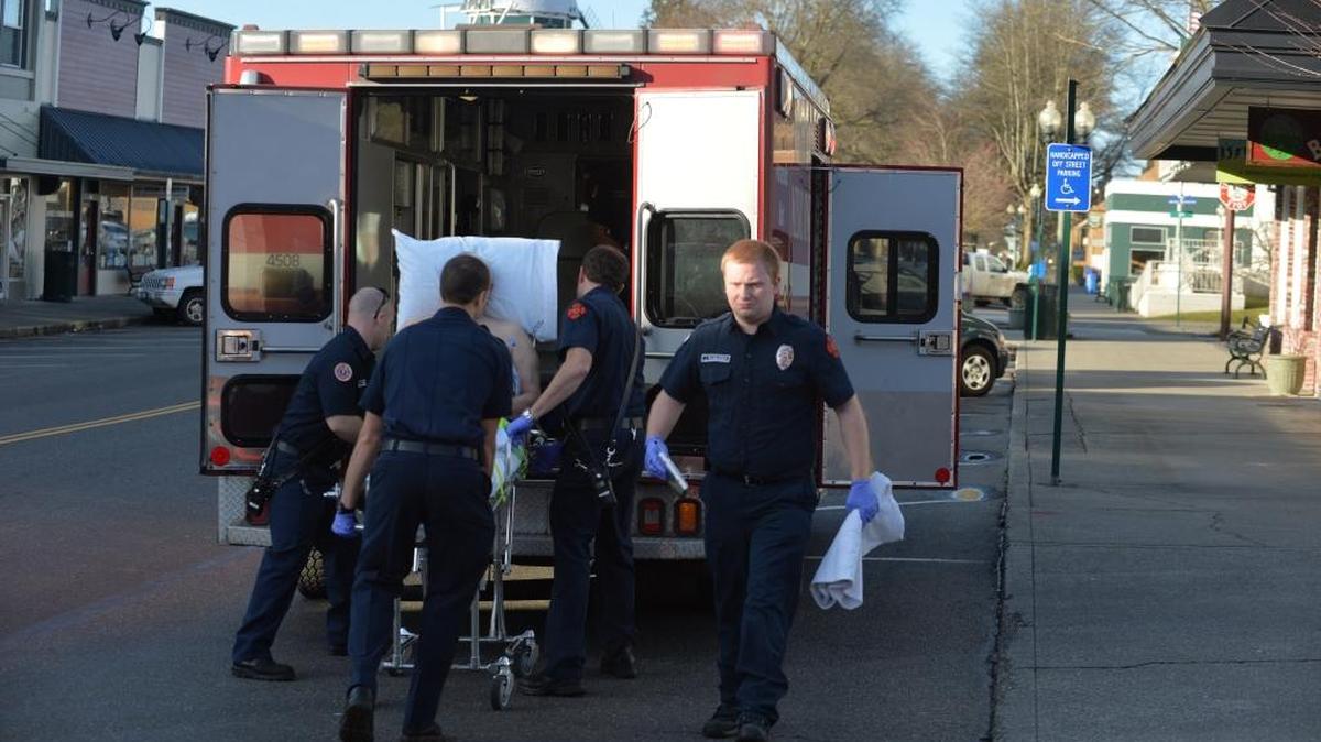 Lynden firefighters Patrick Williams, left, Paul Pluschakov, Lt. Michael Whittley and Justin Rasmussen load a patient into the back of a Whatcom Medic One unit on Front Street in Lynden on Feb. 19, 2014. Whatcom County voters will be asked to pass a property tax levy to help pay for Emergency Medical Services on the November 2016 ballot.
