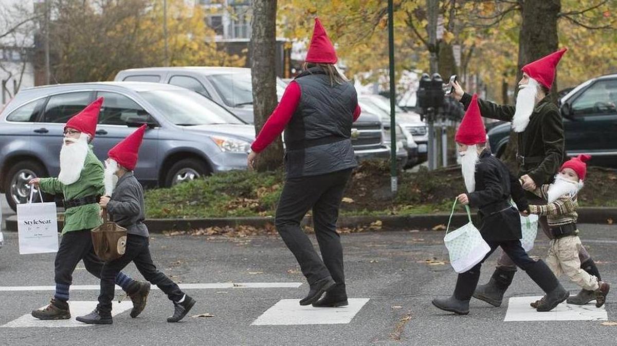 Six of the Seven Dwarfs cross the street in Bellingham on Friday, Oct. 30, during the downtown trick or treat.