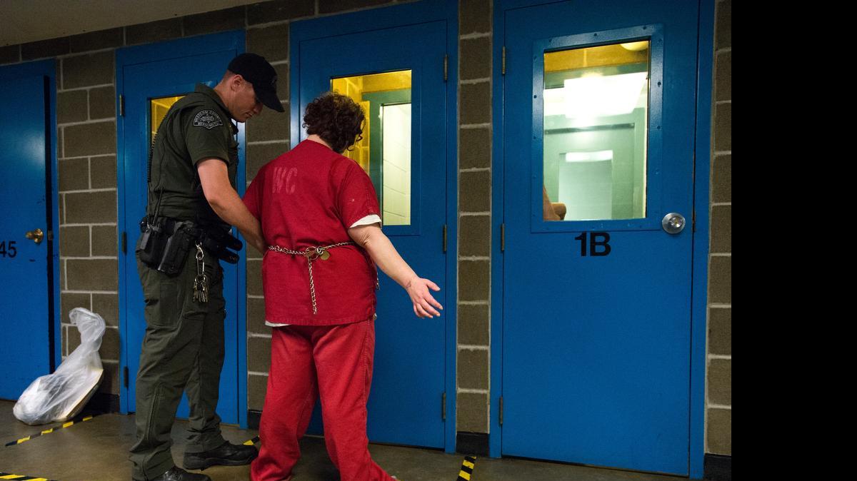 
An inmate is prepared for transport on Thursday, July 2, at Whatcom County Jail in Bellingham. The county is moving ahead with plans for a new jail, even if Bellingham officials don’t sign on to it.
