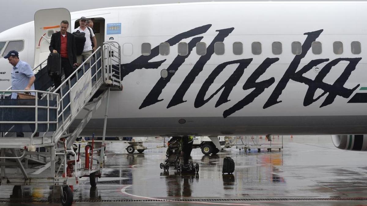 Passengers disembark from an Alaska Airlines plane arriving from Las Vegas at Bellingham International Airport, Feb. 25, 2015. Alaska announced it is offering four new flights out of its Portland, Ore. airport.