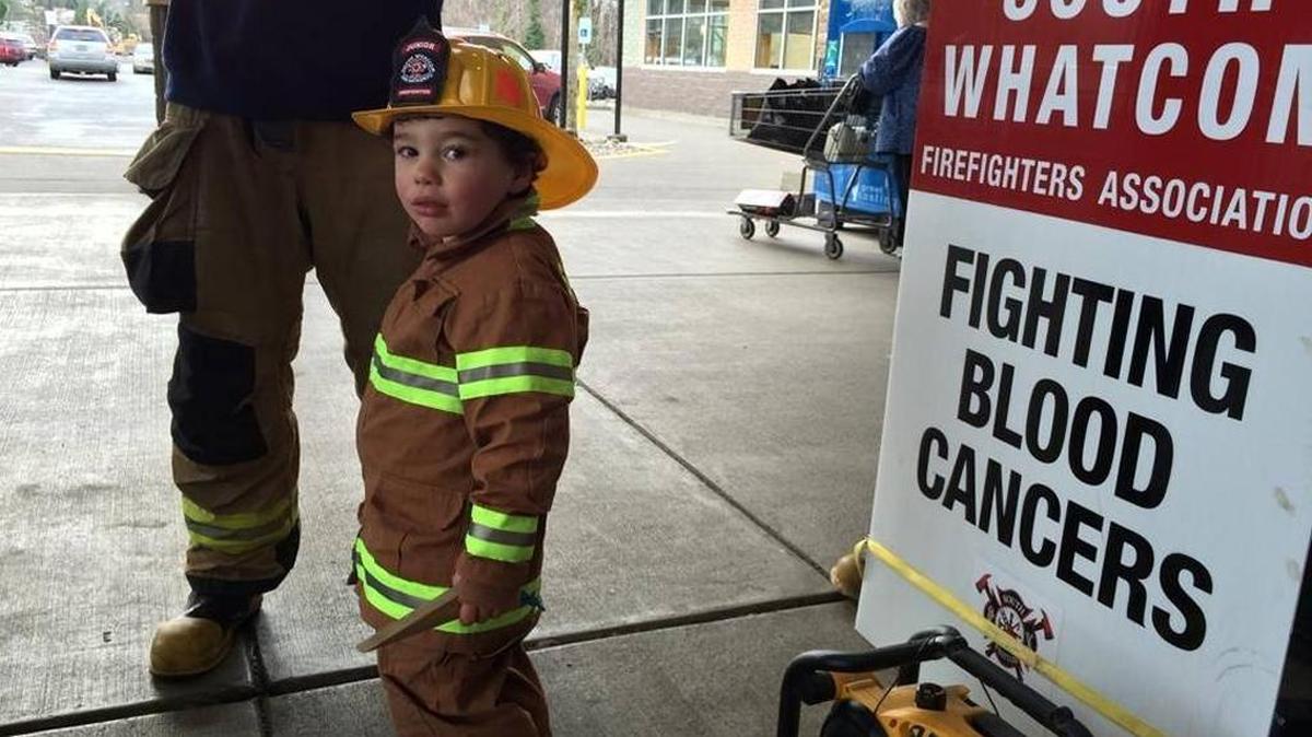 Milo Hackett, son of a South Whatcom Fire Authority firefighter, attends a fundraising event for the Leukemia and Lymphoma Society in February at Fred Meyer on Lakeway Drive.