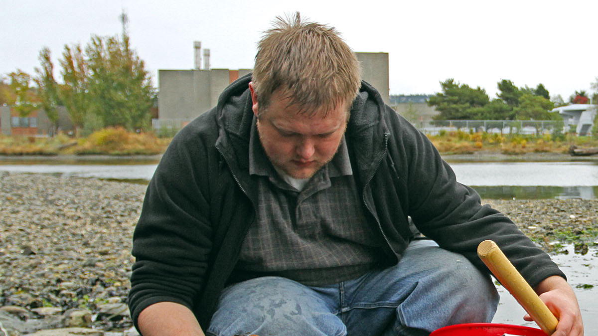 Justin Coslor of Bellingham looks for clams, mussels, oysters and sea cucumbers during low tide in the morning at Marine Park on Oct. 7, 2011. “I enjoy bringing home dinner,” Coslor said.