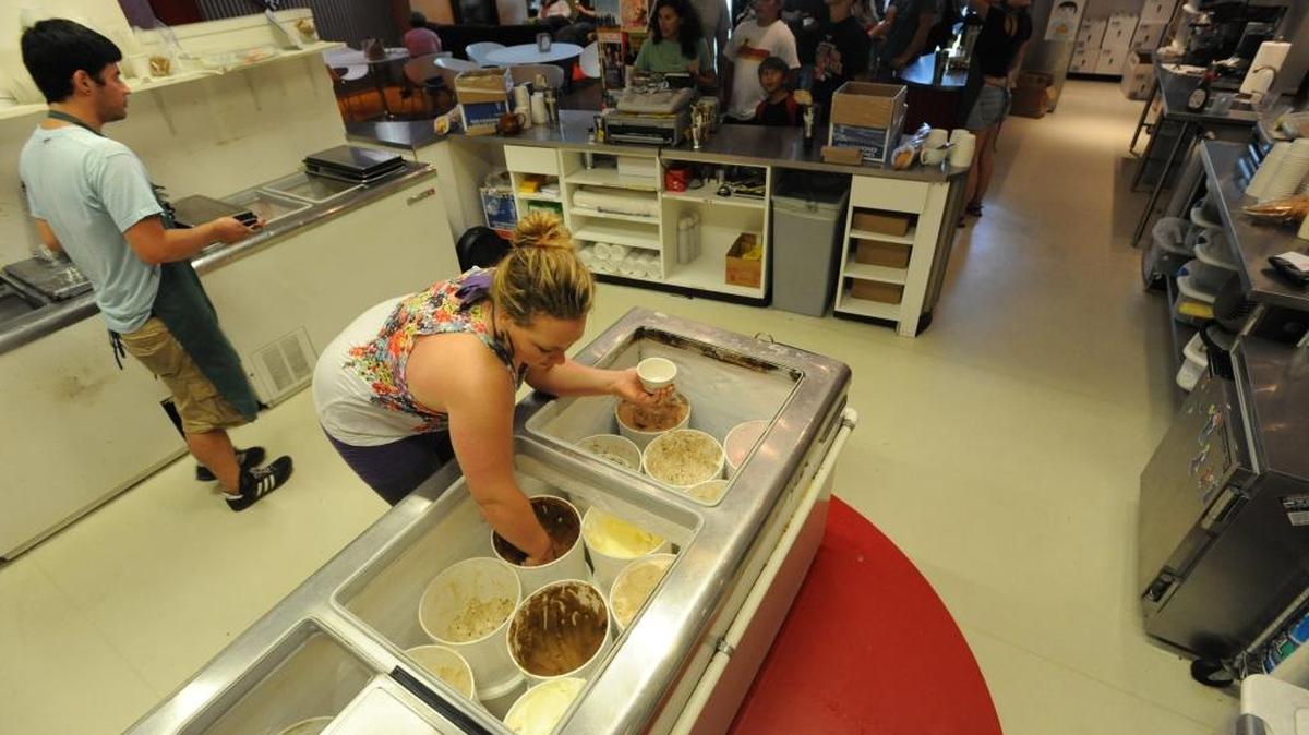 Ice cream maker Allison Constantin scoops out a bowlful of super chocolate ice cream while manager Scott Lew delivers a tasting sample at Mallard Ice Cream on Railroad Avenue in August 2011. The ice cream maker was one of nine ice cream shops ranked among the best in the United States by New York City media website Mic.com.