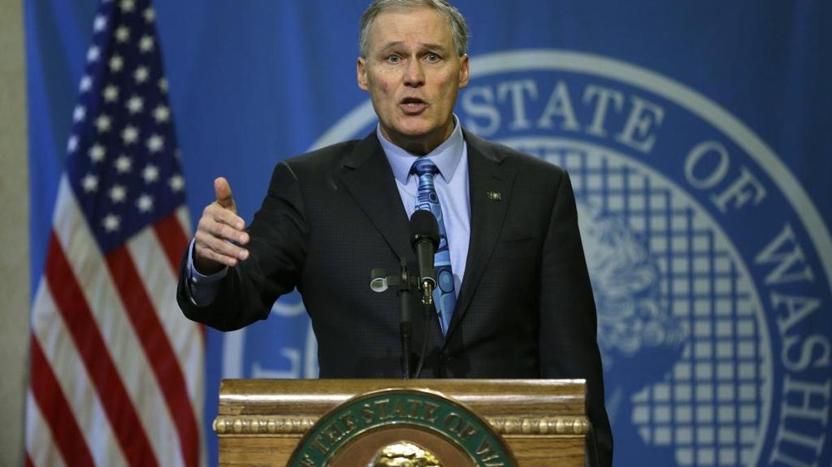 Washington state Gov. Jay Inslee talks to reporters, March 6, 2017, at the Capitol in Olympia. Inslee on Monday joined the governors of Alaska, Colorado and Oregon in asking the Trump administration to let pot experiments continue.