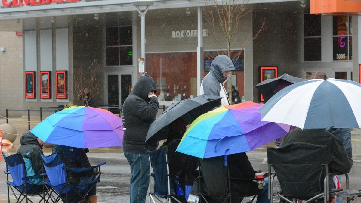Star Wars fans wait outside the Barkley Village 16 theater on Thursday afternoon, Dec. 17, for first showing of “StarWars: The Force Awakens,” at 7 p.m.
