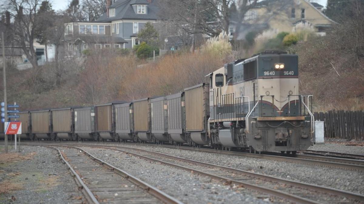 A Burlington Northern Santa Fe engine pushes a train load of coal through Bellingham, Wednesday, Jan. 15, 2014. Among the concerns about a proposed coal terminal at Cherry Point was the number of trains that would be running through urban areas.