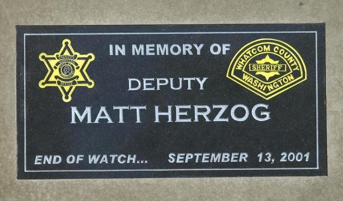Detail of a bench dedicated in honor of Whatcom County Sheriff's Deputy Matt Herzog, who died in an crash while pursing a speeding car Sept. 13, 2001.The bench is outside the south entrance of the Whatcom County Courthouse.
