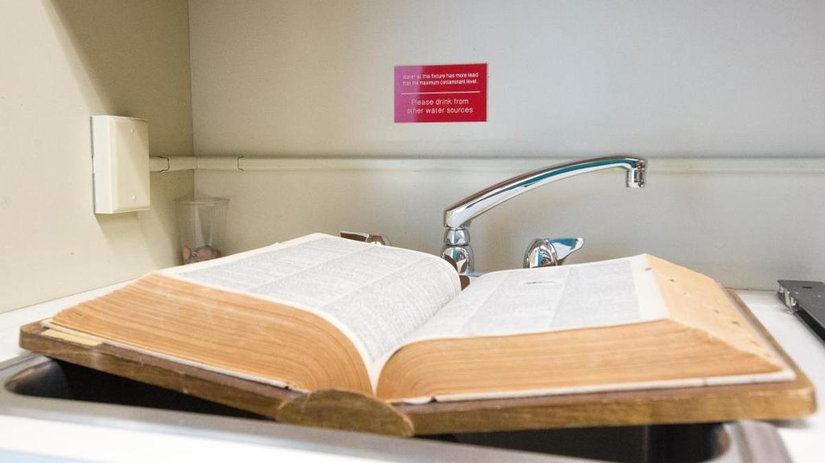 A sink in Artzen Hall 415C on the Western Washington University campus sits unused and covered with a book due to a sign warning of high lead levels on Friday, April 8.