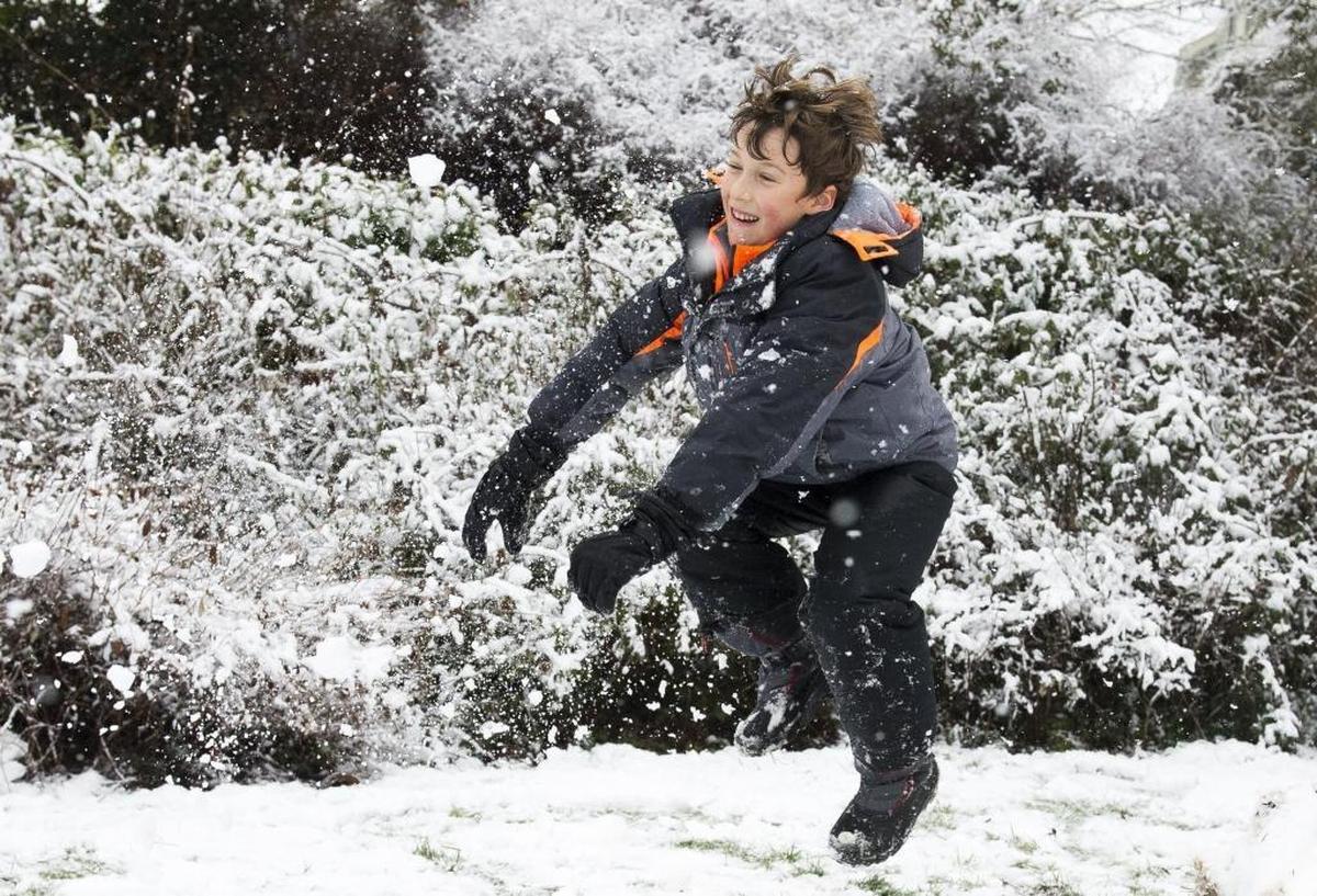 Bellingham resident Luca Pasquini, 8, is hit by a snowball thrown by his father on Christmas Eve in 2016.