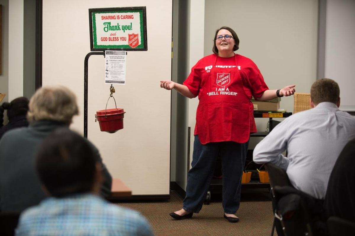 Salvation Army Capt. Niki Woollin talks to applicants about working as a bell ringer during a 2017 hiring event at Goodwill.