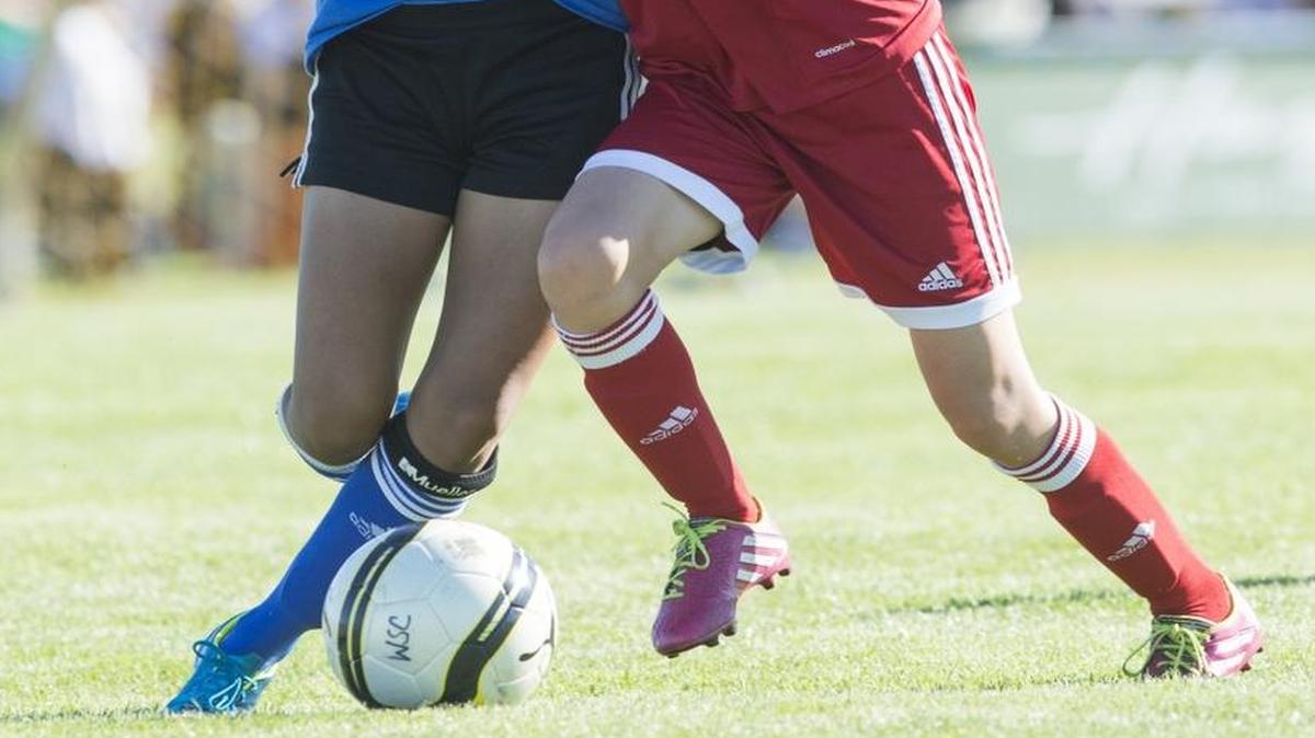 Whatcom Rangers player Payton Kapp, left, battles for the ball with Mountain United’s Krystal Herfst at the 2015 Wilson Motors Baker Blast soccer tournament on Friday, June 26, at Northwest Soccer Park in Bellingham, Wash.