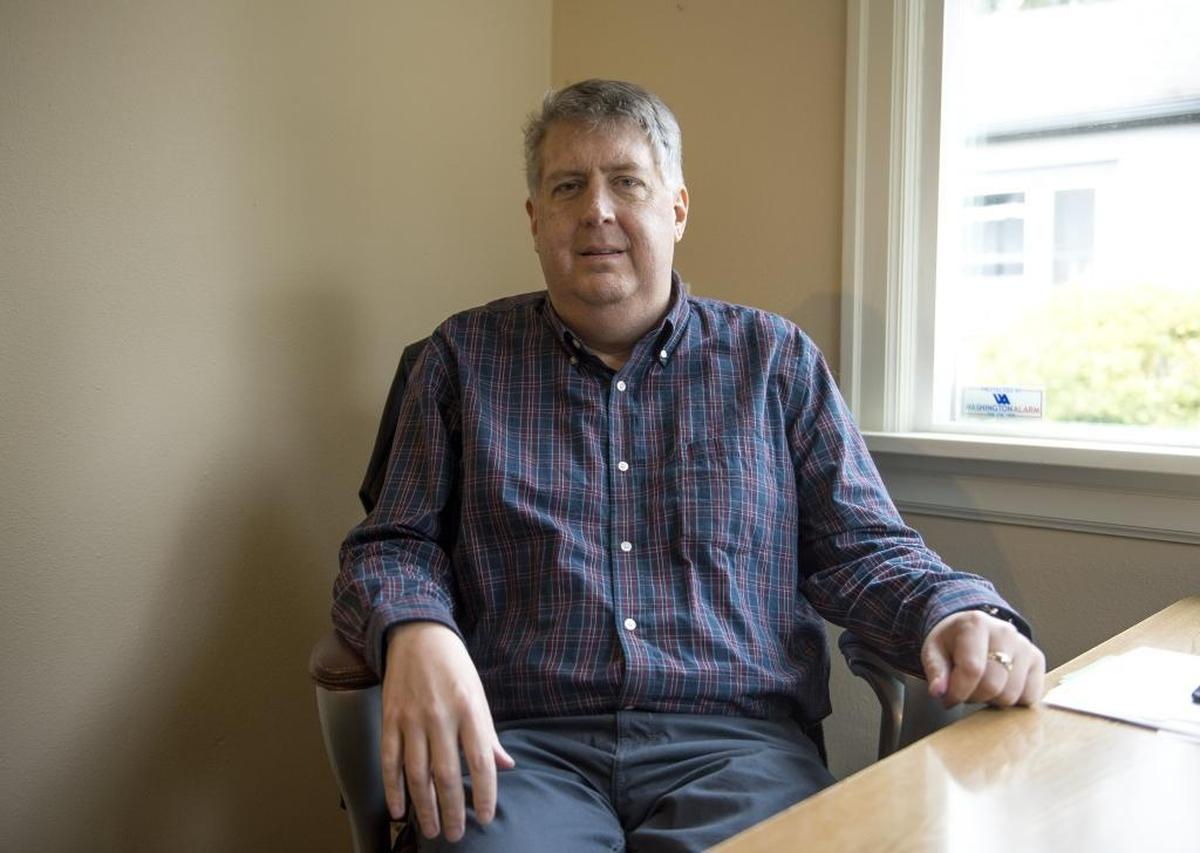 Perry Eskridge is pictured at his desk at the Whatcom County Association of Realtors on Wednesday, Jan. 25, in Bellingham. Eskridge of Ferndale said that every day he’s alive is a gift, after nearly being killed when he was rear-ended 10 years ago on southbound Interstate 5 at Slater Road.
