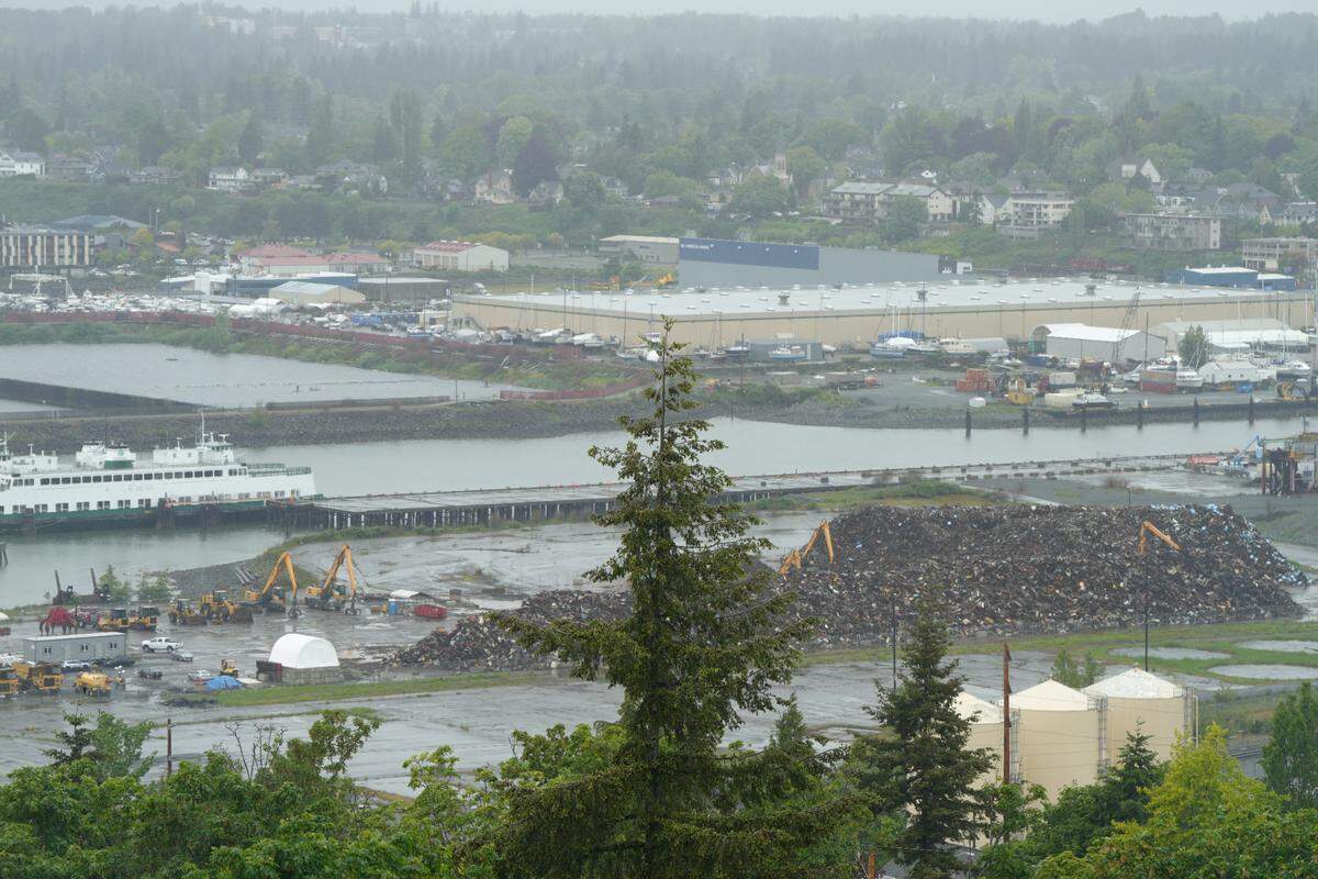 ABC Recycling’s scrap metal piles are visible on Port property along the waterfront on May 21, 2024, in Bellingham, Wash.