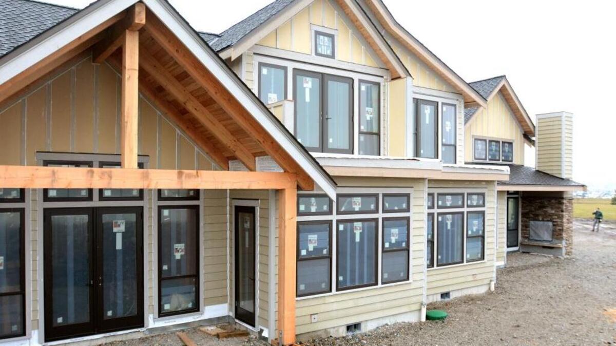Work continues Tuesday morning, Jan. 5, 2016, on the first Semiahmoo Shores duplex being built on the Semiahmoo Spit in Blaine.