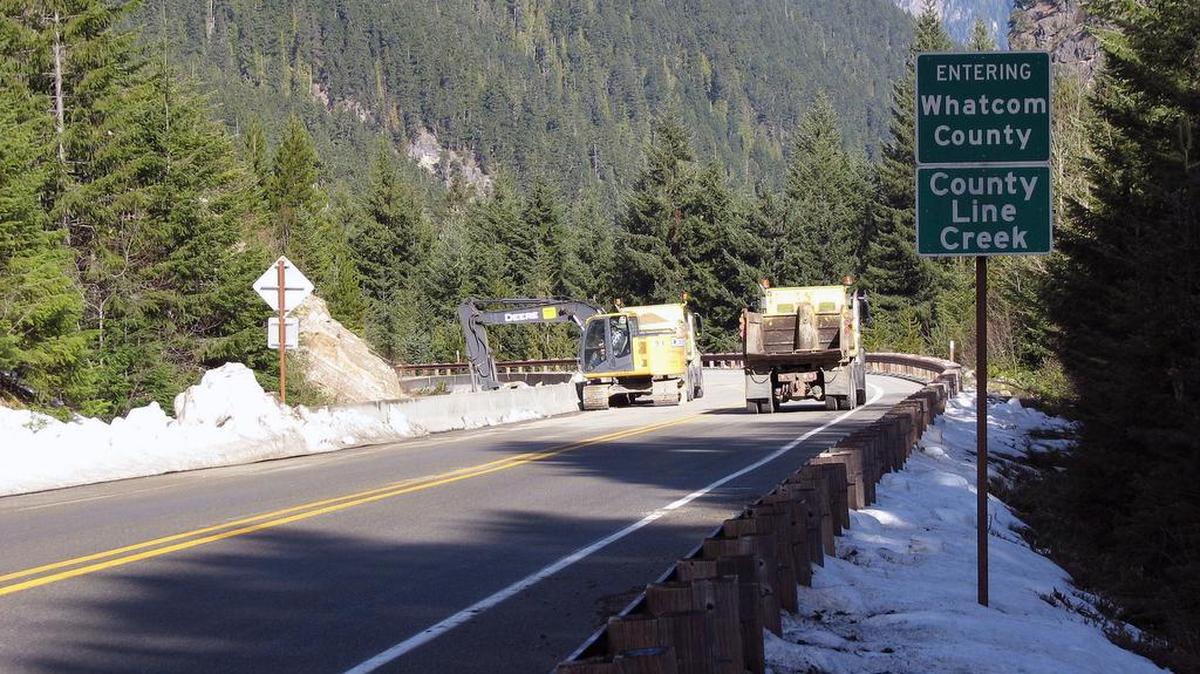 Brian Mount operates an excavator and clears out a rock fall catch areas just west of the Whatcom/Skagit line on State Route 20, also known as the North Cascades Highway, on March 30, 2016.
