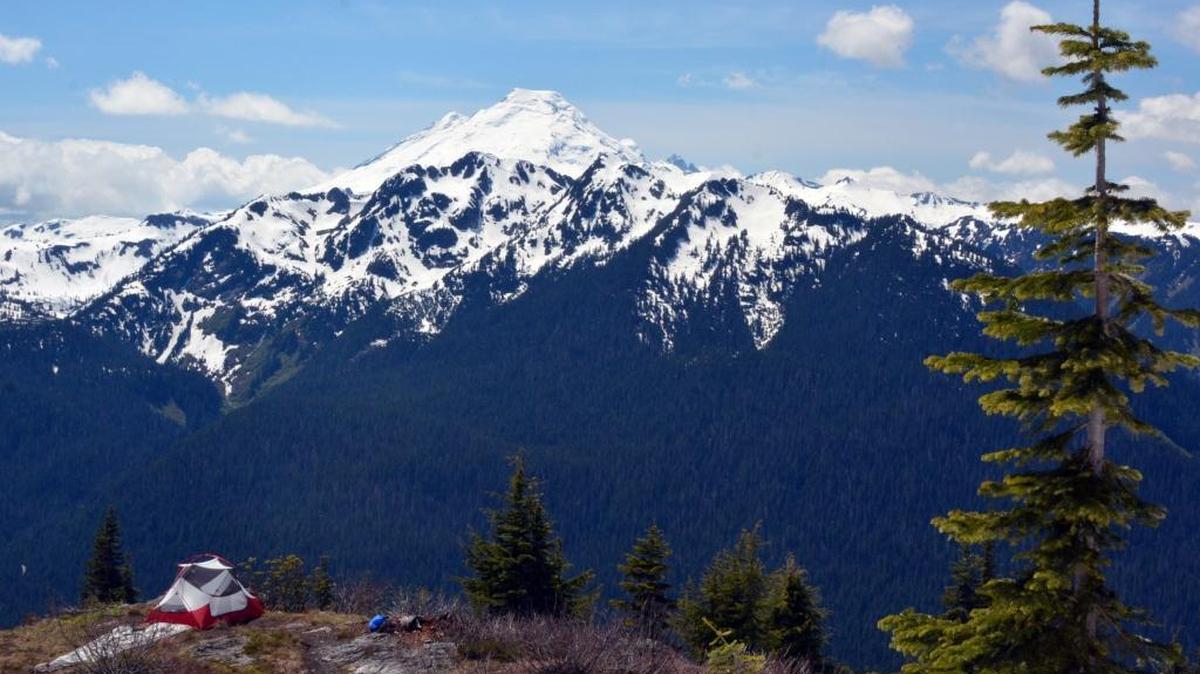 Snow is still visible in the foothills around Mount Baker, as seen from a campsite on Goat Mountain Monday, May 30, 2016.