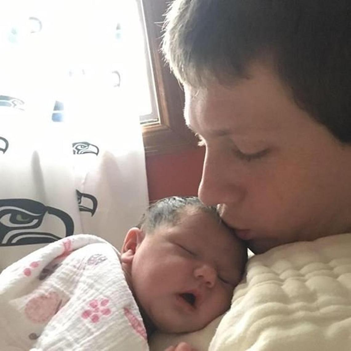 Phil Moyer nuzzles his newborn daughter Penelope Moyer in a photo from Phil’s Facebook page. Both were killed in a Mother’s Day wreck that injured Pamela Moyer, Phil’s wife and Penelope’s mother.