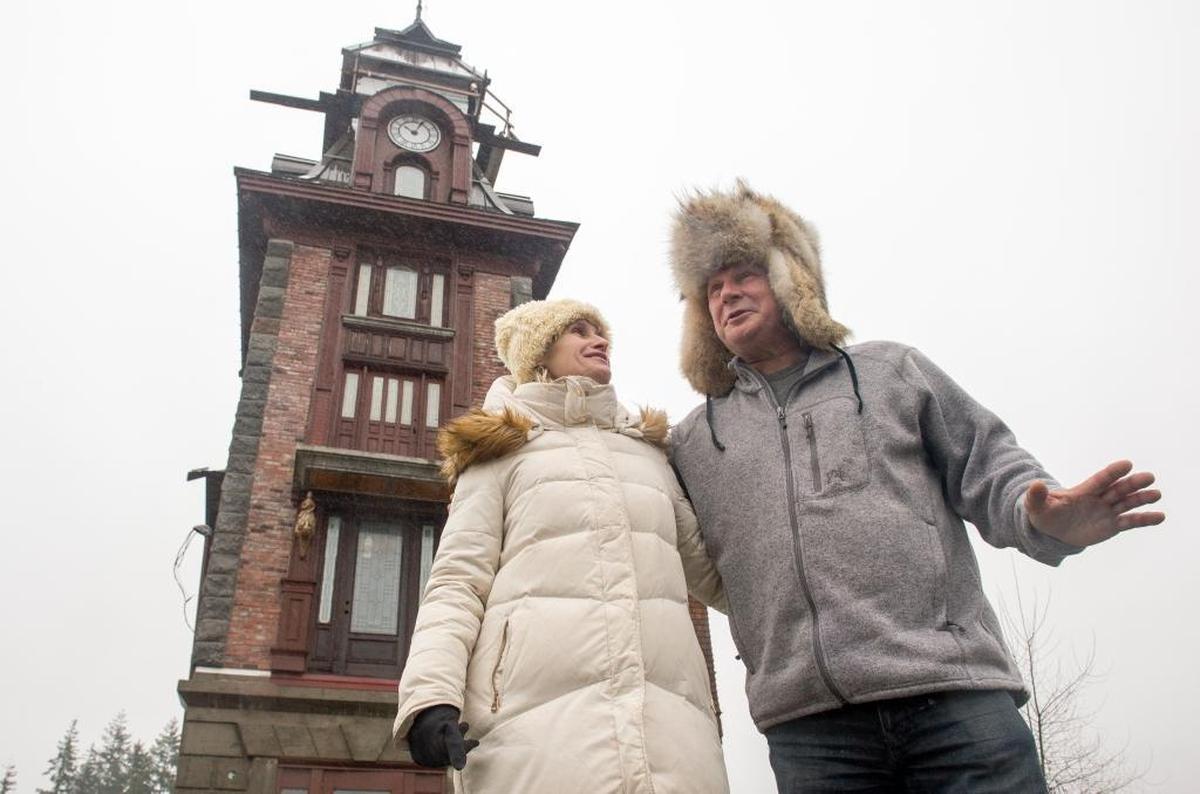 Artus “Art” Rojsza and Margaret Rojsza stand outside their home on Friday, Jan. 12, in Ferndale. The City of Ferndale has resolved a legal dispute with the couple over a permit to renovate their house at 2147 Main St., also known as the “Clock Tower.”