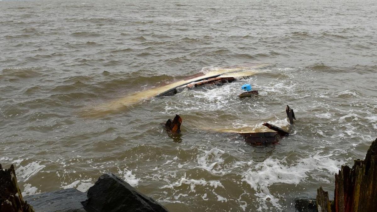 The remains of the wreckage of the fishing boat Bergen rest against a rocky shore near Little Squalicum Beach on Monday, March 14, 2016. The boat drifted onto the rocks during last Thursday’s windstorm.