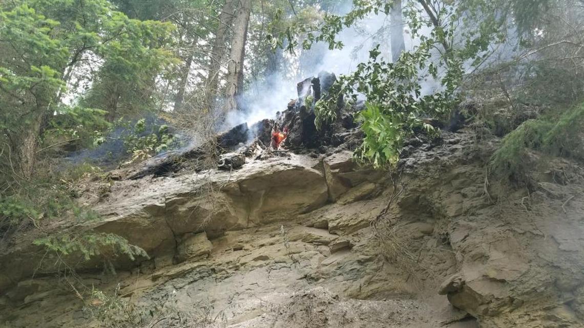 Fire burns Wednesday morning along a steep ridge in the Chuckanut Mountains.