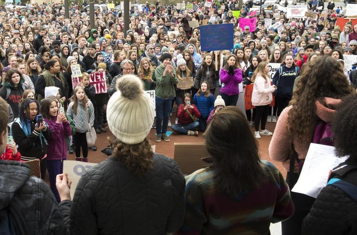 Students ranging in ages from middle school to high school fill the area in front of Bellingham City Hall to protest gun violence in schools on Wednesday, Feb. 21, in Bellingham.