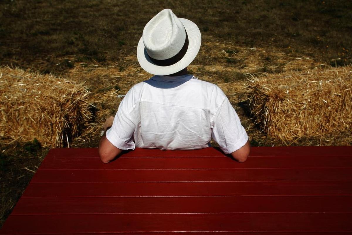 Louis Ledford, of New Orleans, listens as singer-songwriter Robert Sarazin Blake performs at the Reefnet Festival on Lummi Island.
