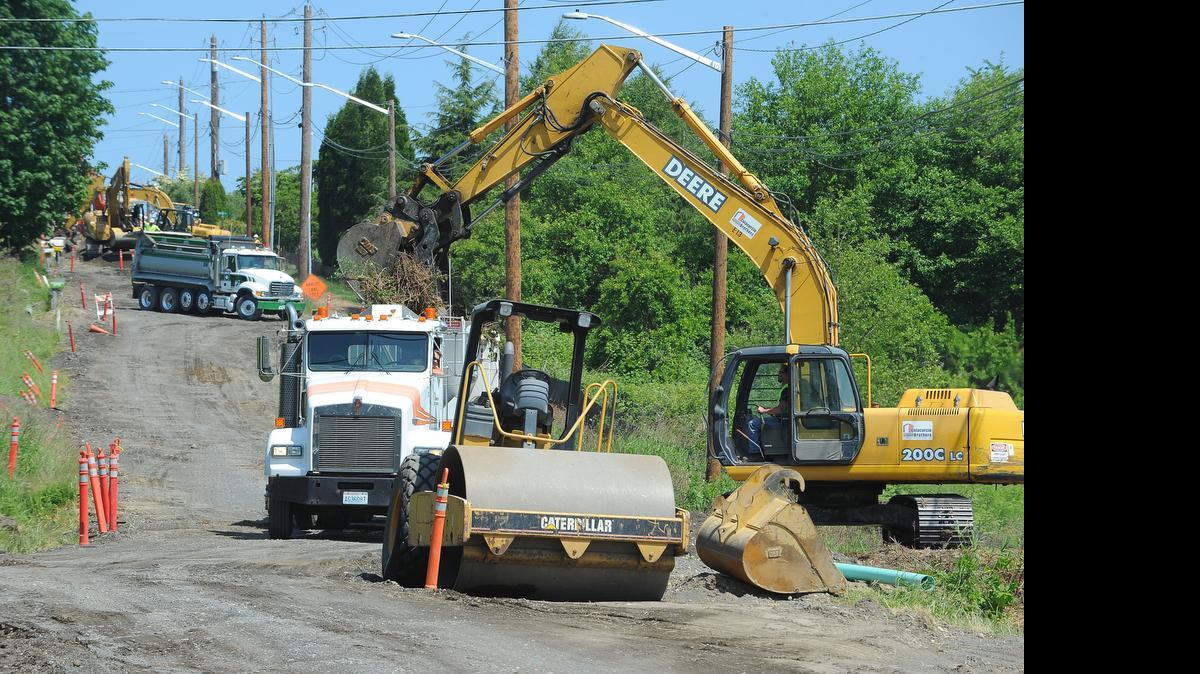 Road crews work to improve Ferndale’s Church Road on June 2, 2014. A plan to levy a penny gas tax to pay for roads and infrastructure in Ferndale failed at the polls in 2014; candidates for Ferndale mayor debate how to fix the city’s roads.
