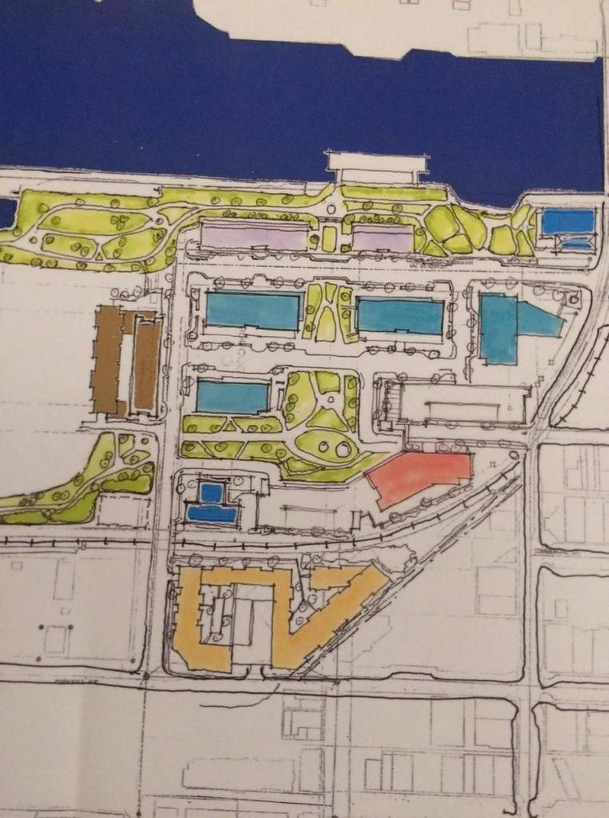 A rough sketch of the changes staff from Harcourt, Port of Bellingham and the City of Bellingham are proposing for waterfront development, presented at a TAG event in the Granary Building on Oct. 18. The Granary Building in this sketch is in the upper right corner in blue; proposed condominiums near the Whatcom Waterway are shown in light purple; the proposed Boardmill hotel is in brown on the left and the proposed student housing or retirement facility is at the bottom in gold.