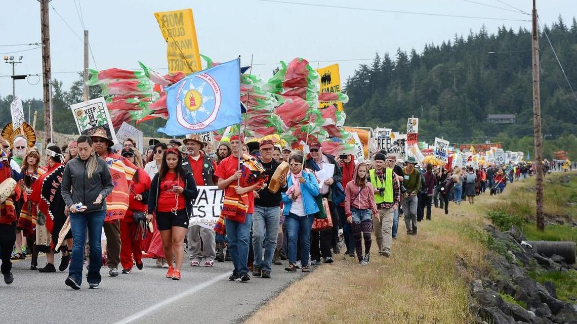 Protestors march near oil refineries in Anacortes, Wash., on Saturday, May 14, 2016. The protests are part of a series of global actions calling on people to “break free” from dependence on fossil fuels.