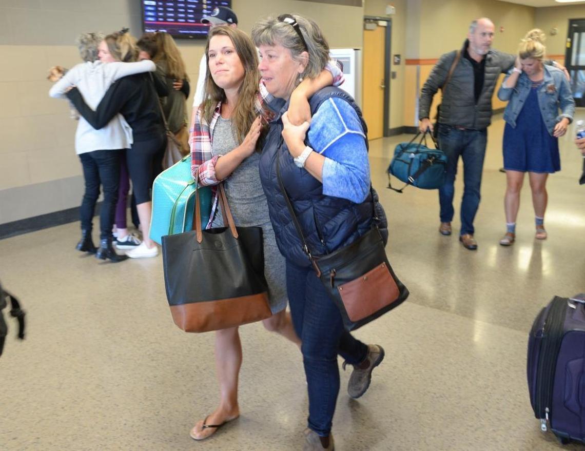 Family members greet survivors of the Las Vegas concert shooting after they arrived at the Bellingham International Airport Oct. 2, 2017.