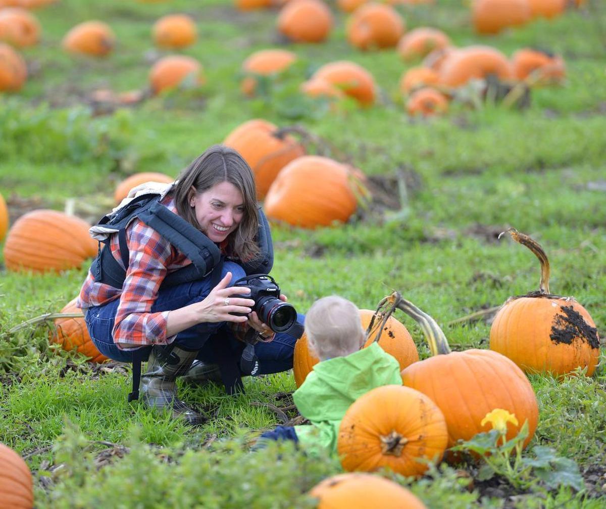 Katie Schafer of Bellingham photographs her daughter Grace Schafer in 2016 at the pumpkin patch at Stoney Ridge Farm in Everson.