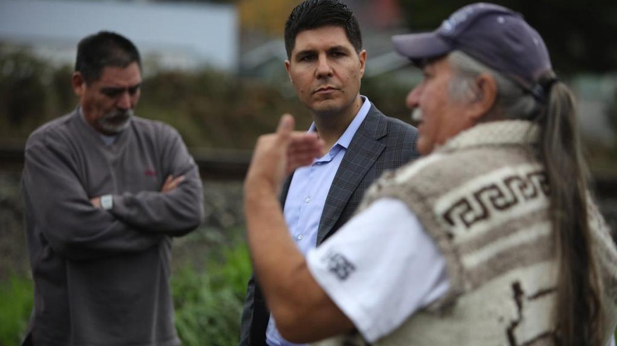 Native American lawyer Gabriel Galanda, center, listens to Nooksack members talk about disenrollment. The Nooksack tribe has banned Galanda, who has represented members in their fight against disenrollment for three years, from practicing in its courts.