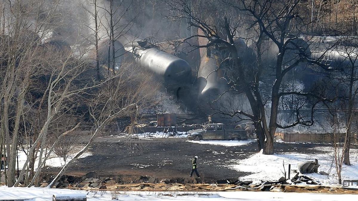 
A crew member walks near the scene of a train derailment near Mount Carbon, W.Va., on Tuesday, Feb. 17, 2015. A CSX train carrying more than 100 tankers of crude oil derailed the day before in a snowstorm, sending a fireball into the sky and threatening the water supply of nearby residents. 

