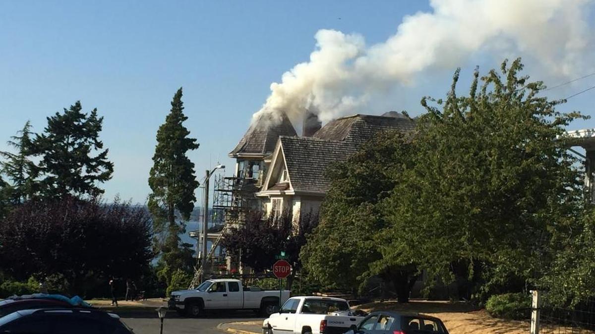 Crews contained the fire at this house, 158 S. Forest St., to the roof and turret area. Cause of the Monday afternoon fire remains under investigation.