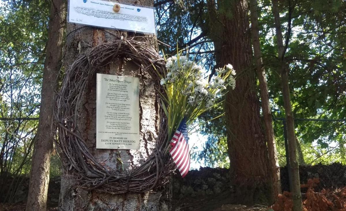 A memorial on the 500 block of Samish Way in Bellingham for Whatcom County Sheriff’s Deputy Matt Herzog, who died Sept. 13, 2001, after the patrol car he was riding in crashed while chasing a suspect. He was 27 years old.
